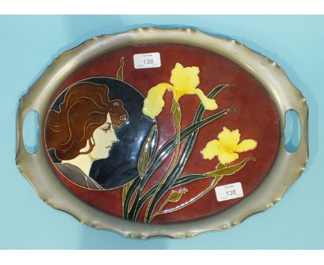 An Art Nouveau ceramic oval tray designed by Carl Sigmund Luber and manufactured by the Nuremberg factory of Johann von Schwa