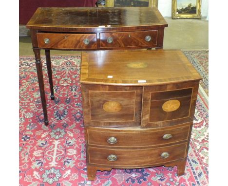 A mahogany bow-fronted side table fitted with two frieze drawers, on reeded tapered legs, 92cm wide, damage to leg, and a bow