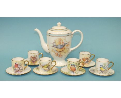 A Royal Worcester part coffee set with painted decoration of garden birds by D Wilson, comprising coffee pot, six coffee cans