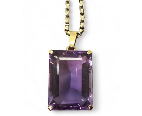 A LARGE AMETHYST PENDANT the substantial amethyst is step cut and has the dimensions of 2.8cm x 2cm x 1.3cm, on a 9ct gold bo