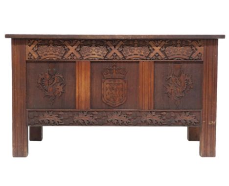 A 19TH CENTURY SCOTTISH OAK JAMES DOWNIE BLANKET CHEST top carved with initials MD and dated 1892 and framed by repeating thi