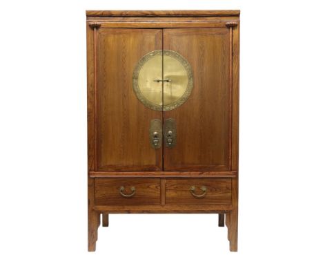 A 20TH CENTURY CHINESE ELM WEDDING CABINET&nbsp; with pair of doors mounted with brass plaque depicting animals of the Chines