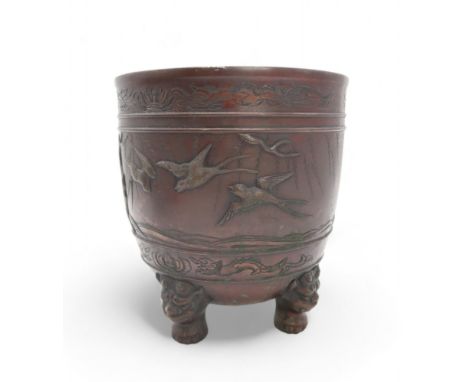 A CHINESE BRONZE JARDINIERE Cast with birds in flight within bands of serpents and pheonix,seal mark,27cm high Condition Repo
