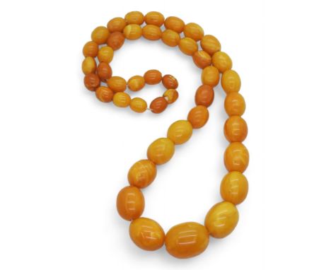 A STRING OF AMBER BEADS butterscotch colour, largest bead, approx 23.7mm x 18.7mm, smallest bead 10.5mm x 8.3mm, overall leng