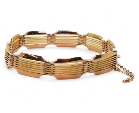 A DECORATIVE GATE BRACELET made in 9ct rose gold, length appro 17.5cm, width 1.1cm, stamped 9c stamped to the tongue. weight 