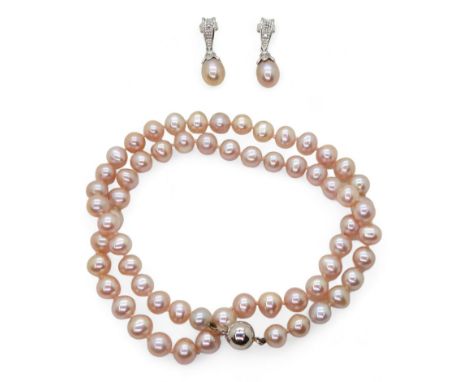 A PINK PEARL SUITE the pink slightly baroque pearls are each about 7mm, with an overall length of 46.5cm, with a 9ct white go