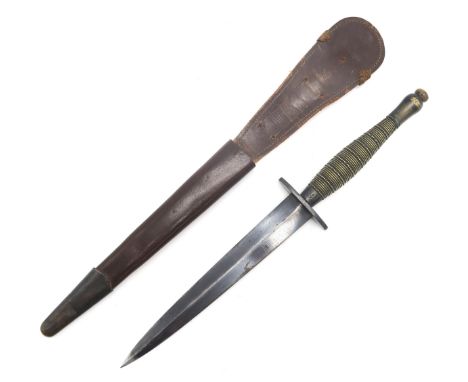 A WW2 FAIRBAIRN-SYKES "BEADED AND RIBBED" PATTERN FIGHTING KNIFE The grip marked with Broad Arrow stamp over number 1, housed