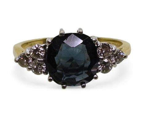 A BLUE GEM &amp; DIAMOND RING the 18ct galleried mount is set with six brilliant cut diamonds with an estimated approx diamon