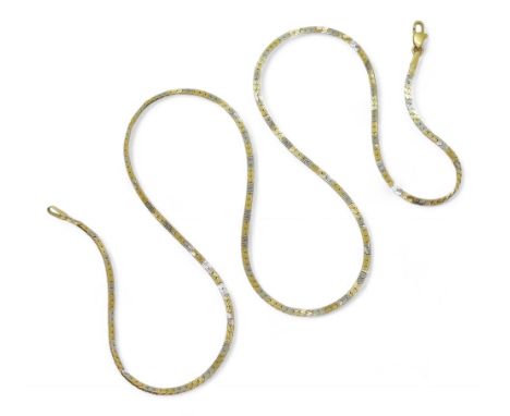 AN 18CT DECORATIVE CHAIN made in yellow and white gold with an engraved pattern, length 50cm, weight 7.4gms Condition Report: