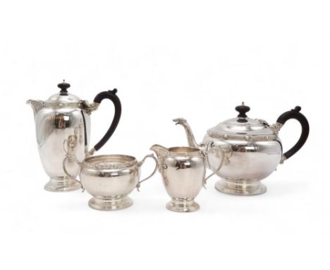 AN ELIZABETH II FOUR PIECE SILVER TEA SERVICE by Adie Brothers Ltd, Birmingham 1960, of baluster form, with bands of celtic k