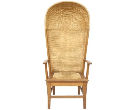 A 20TH CENTURY OAK FRAMED PORTERS STYLE ORKNEY CHAIR  with domed rush backrest over drop-in rush seat flanked by scrolled arm