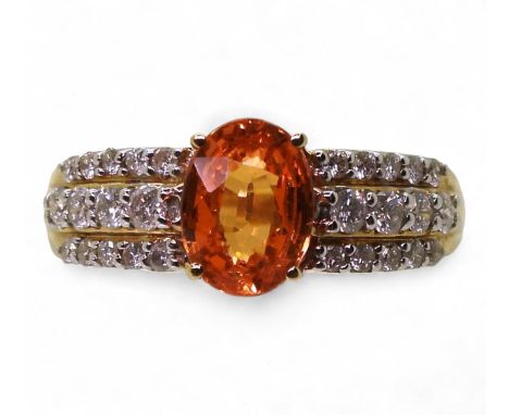 A MANDARIN GARNET &amp; DIAMOND RING the 14k mount is set with an oval spessartite garnet of 8mm x 6mm x 4mm, with three para