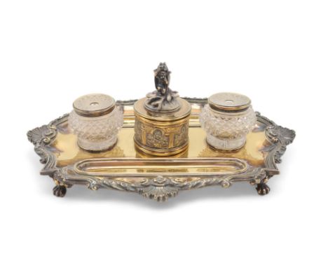 A GEORGE IV SILVER GILT INKSTAND by Richard Sibley, London 1827, of oblong lobed form, with a cast scrolling shellwork border