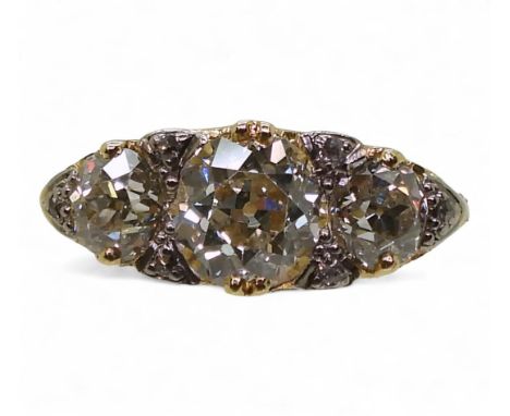 A SUBSTANTIAL THREE STONE DIAMOND RING set with three old cut diamonds with an estimated approx total diamond carat weight of