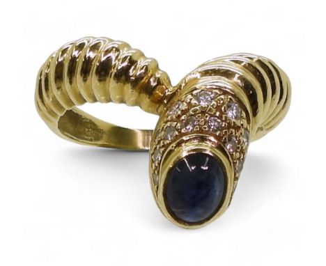 A SAPPHIRE &amp; DIAMOND RING made in bright yellow metal with a ribbed 'V' design. Finger size T, weight 8.7gms Condition Re
