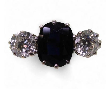 A SAPPHIRE &amp; DIAMOND RING set with two old cut diamonds, with an estimated approx combined diamond carat weight of 1ct, t