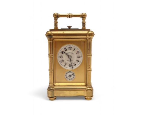 A MINIATURE TIFFANY REPEATING CARRIAGE ALARM CLOCK the ivory face with Arabic numerals and alarm dial within a gilded and gla