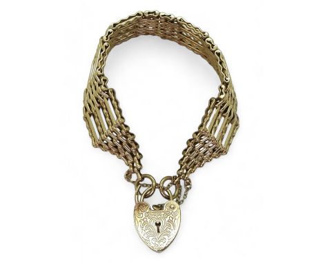 A 9CT GOLD GATE BRACELET with seven decorative bars and heart clasp, length 19cm, weight 33.7gms Condition Report:Available u