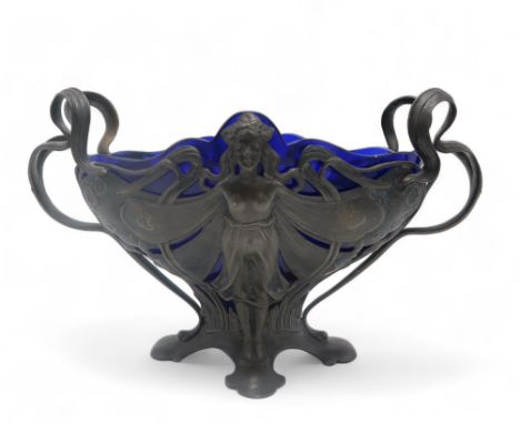 A WMF ART NOUVEAU DISH modelled as a fairy with her wings outstretched, with sinuous handles and blue glass liner, 18cm high 