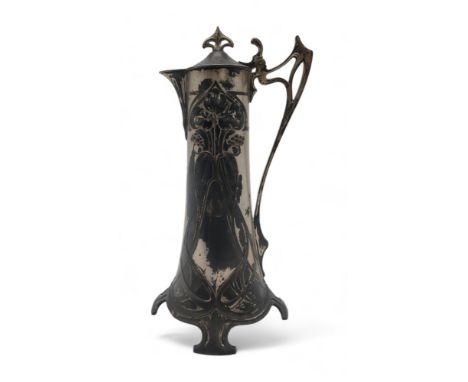 A WMF JUGENDSTIL SILVER PLATED CLARET JUG in the Art Nouveau style with stylised berry and foliage design, with open whiplash