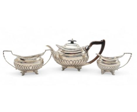 A&nbsp; LATE-VICTORIAN BACHELORS SILVER TEA SERVICE by Thomas Bradbury &amp; Sons, London 1899, the body fluted, with rocaill