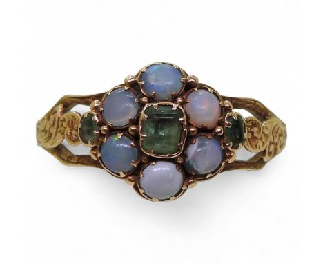A VICTORIAN RING made in bright yellow metal set with opals and emeralds in a flower formation, finger size P1/2, weight 2gms