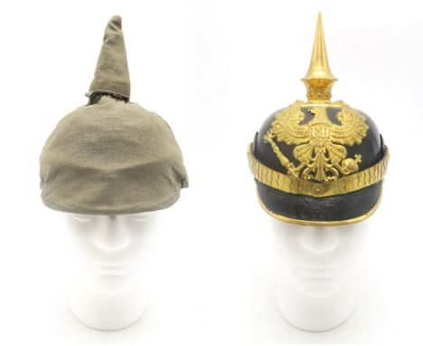 AN IMPERIAL GERMAN PRUSSIAN OFFICER'S PICKELHAUBE  Fitted with a tall spike, the base having star fittings; and scaled chinst