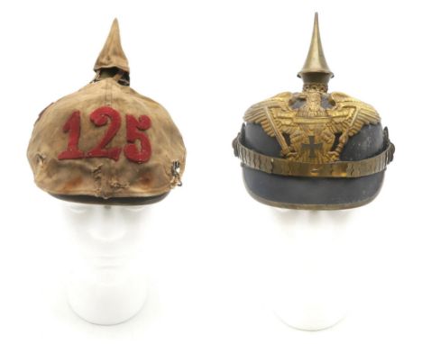 AN IMPERIAL GERMAN PRUSSIAN OFFICER'S PICKELHAUBE With scaled chinstrap, the spike having star fittings; with canvas cover ap