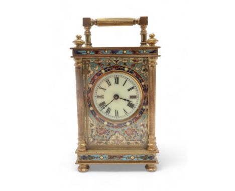 A FRENCH CHAMPLEVE ENAMEL CARRIAGE CLOCK the white dial with Roman numerals, the key wound movement with platform escapement,