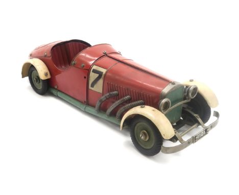 A 1930s MARKLIN 1107 R CONSTRUCTION TINPLATE RACING CAR In red, green and white, fitted with a clockwork motor, lacking key, 