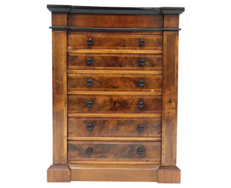 A VICTORIAN WALNUT VENEERED APPRENTICE STYLE WELLINGTON CHEST&nbsp; with inverted breakfront cornice over six graduating draw