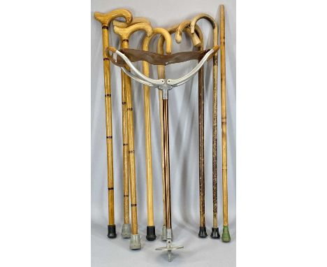 EIGHT VINTAGE WALKING STICKS &amp; AN ALUMINIUM AND LEATHER SHOOTING STICK, natural woods with curved or carved handles, the 