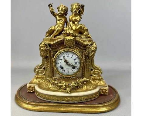 19TH CENTURY FRENCH GILDED BRONZE MANTEL CLOCK, the case surmounted with figures of two putti, one with grapes, one playing t