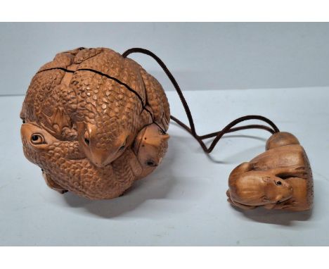 Netsuke Frog ball with tiny glass eyes together with a carved toggle of a Frog on an Acorn 
