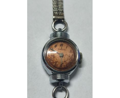 A "Marvin Watch Co." ladies' wristwatch with a 9ct. White Gold strap and clasp, stainless steel back, serial #658257