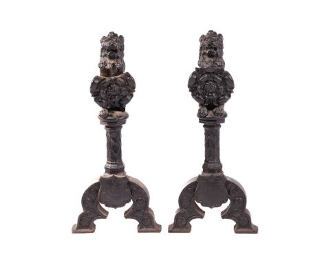 To a design by Augustus Welby Northmore Pugin; a pair of cast iron fire dog fronts with heraldic lion and Tudor rose motifs a