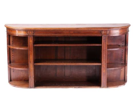 Howard &amp; Sons of 26-27 Berners St, London a Victorian walnut open credenza library bookcase of bow-fronted form with a fi