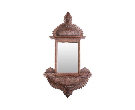 An Anglo-Indian carved wood mirror, the rectangular glass over a lower shelf, 94 cm x 49 cmFirst half 20th Doubt that it was 