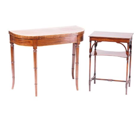 A George III bow-fronted mahogany fold-over tea table, with satinwood crossbanding supported on turned legs with splayed feet