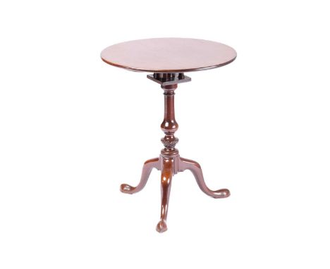 A small well-drawn George III mahogany circular snap-top wine table, with a birdcage block above a gadrooned urn and baluster