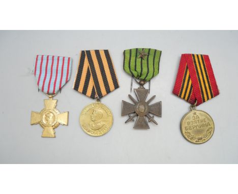 Four WW2 medals with ribbons; two French 'Croix du Combatant' medals (one made of bronze with bronze star) and two Russian 19