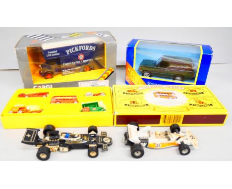 Four Corgi toys, two racing cars including John Player Special, Pickfords lorry, boxed, and Range Rover, boxed, and a Matchbo
