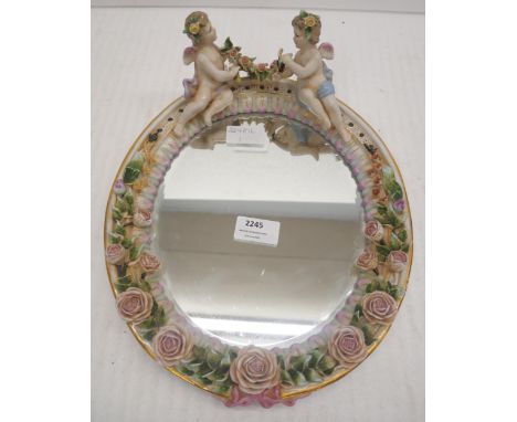 A Dresden style porcelain cherub mirror  **PLEASE NOTE THIS LOT IS NOT AVAILABLE FOR PACKING AND POSTING**