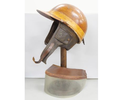 A vintage Cromwell motorcycle helmet with visor