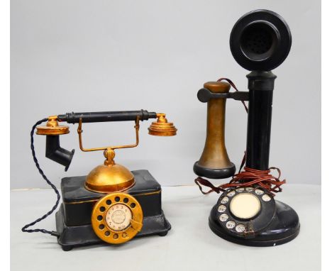 A candlestick telephone and a novelty tin-plate money box in the form of a telephone