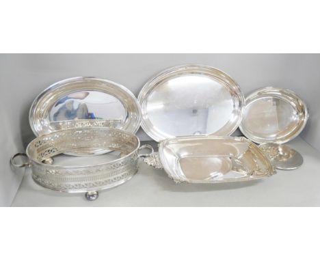 A collection of silver plated items to include a viners cake/dessert fork set, brush and hand mirror, serving spoons and othe