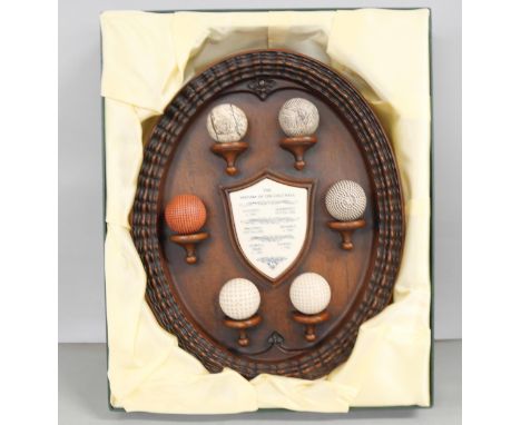 A golf display, The History of the Golf Ball, boxed