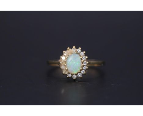 Good Quality Ladies 9ct Gold Oval Opal and Diamond cluster ring Size O. 2g total weight 
