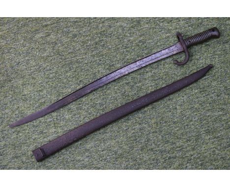 19thC St Etienne Bayonet with engraved detail and scabbard. 70cm in Length 