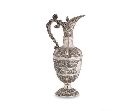 A Victorian silver wine ewer, mark of Charles Boyton II, London 1895, in the Cellini style, intricately decorated throughout,